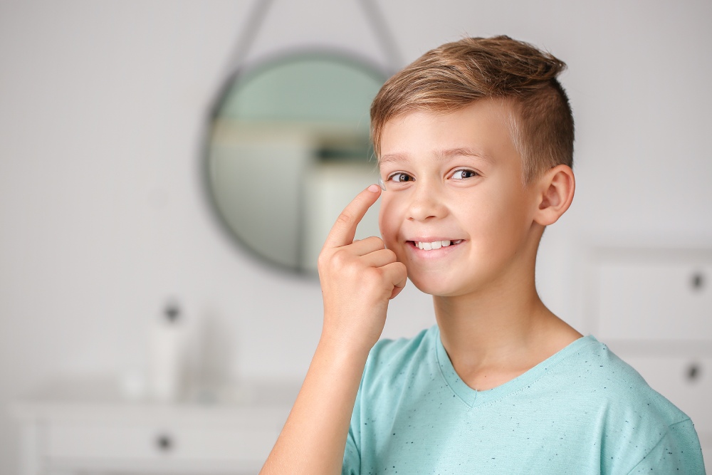 Child putting in contact lens for myopia management