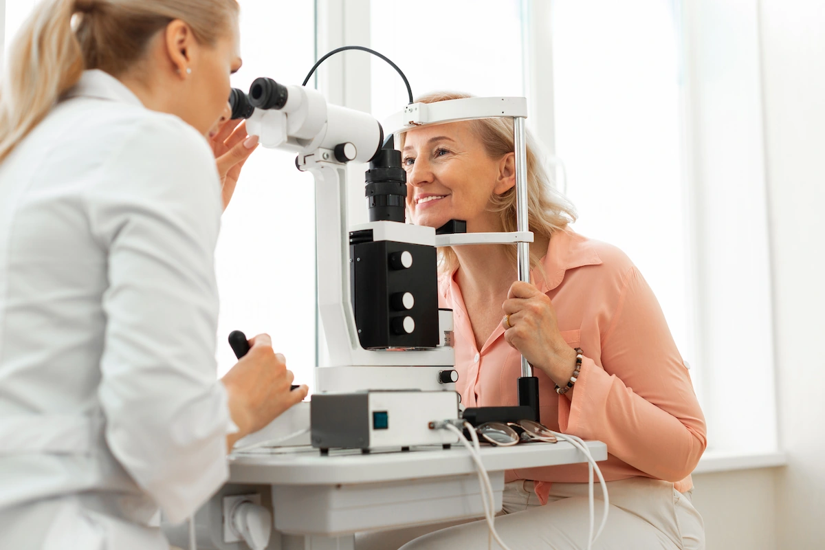 senior-eye-exam senior smiling during eye exam
